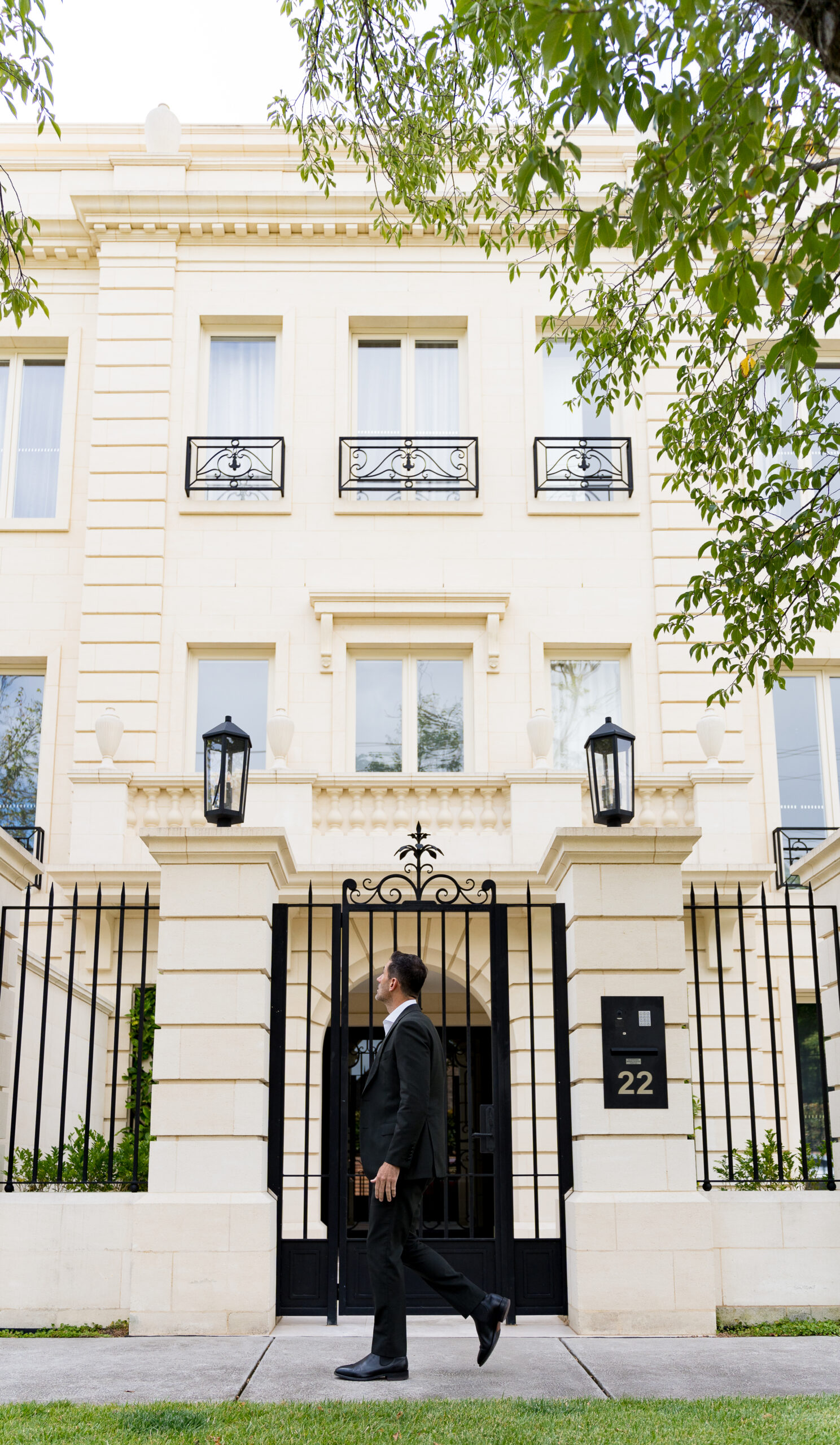 buyer agent walking in front of a property in Toorak Melbourne Australia